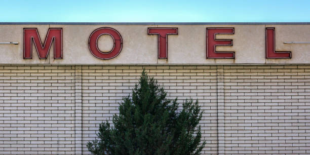 istock Motel sign with lighting tubes on a brick building 1056101650