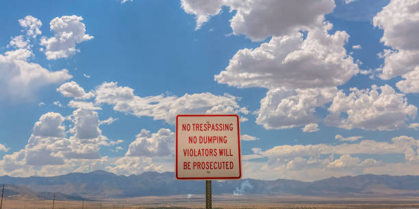 istock No trespassing sign against mountain and sky 1056101696