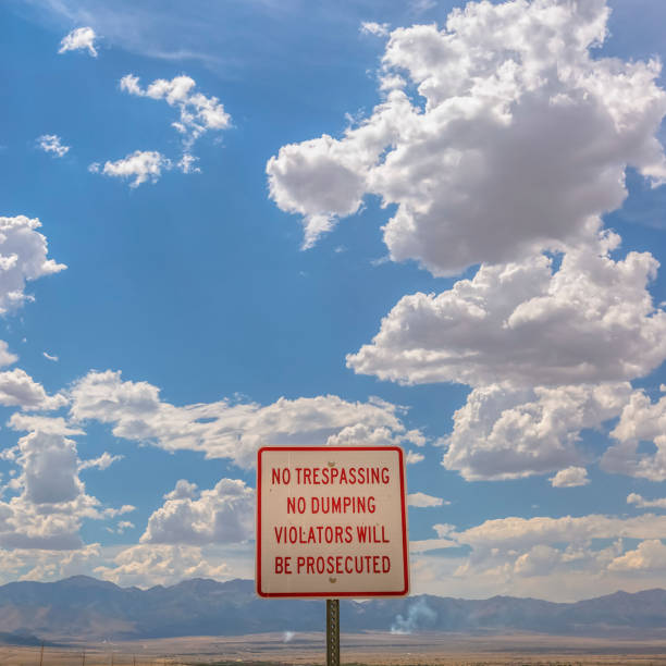 istock No trespassing sign overlooking mountain and sky 1056101698