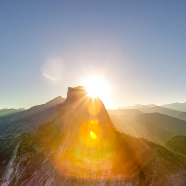 istock Sunrise view of Half Dome with lens flare 1056105286
