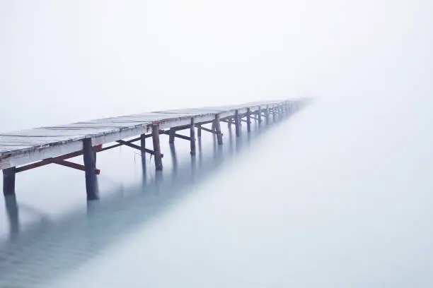 Photo of Foodbridge in the fog with a man standing on it