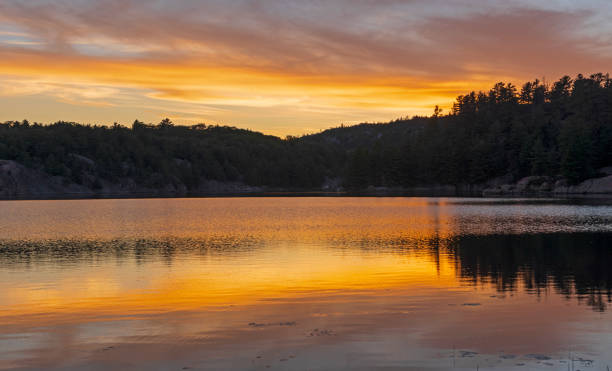 istock Evening Colors on a Wilderness Lake 1056107834