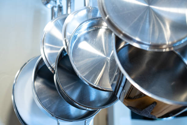 istock Pots and Pans on Hanging Rack in Bright Kitchen 1056112192