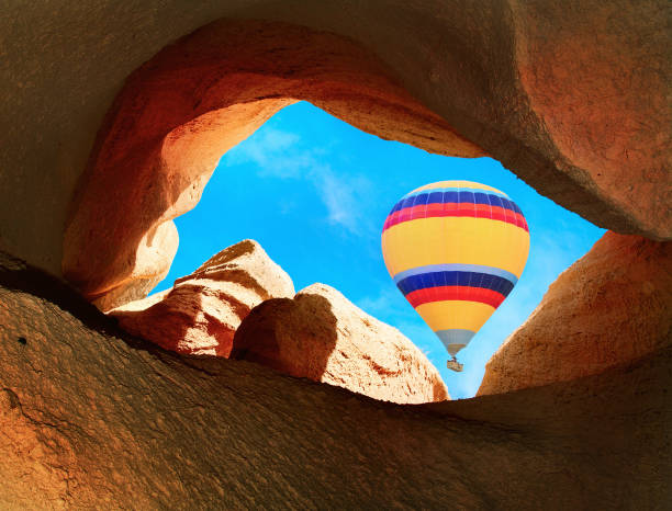 istock Hot air balloons flying over mountains in Cappadocia 1056116468
