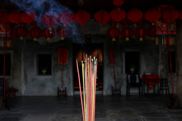 Incense sticks are burning and smoke