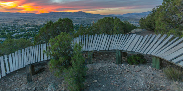 istock Wooden trail on hill overlooking beautiful sunset 1056124440