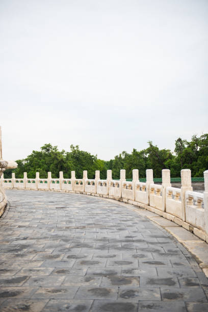 istock Chinese ancient buildings, white marble railings and roads 1056131384