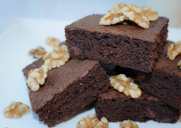 istock Homemade chocolate brownie pieces on white plate 1056135242
