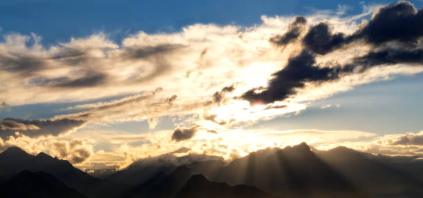 istock High mountains and sea over cloudy sunset sky 1056137710