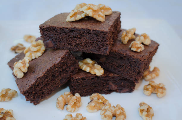 istock Homemade chocolate brownie pieces on white plate 1056138120