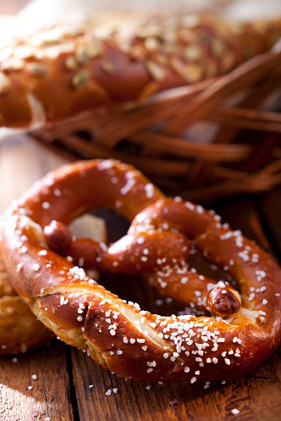 istock Soft baked salted pretzel and bread basket 105614796