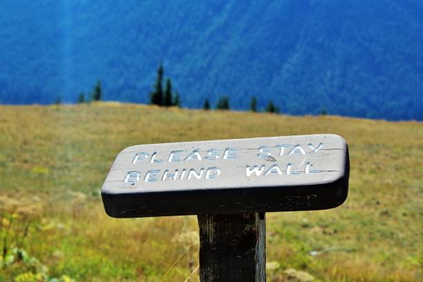 istock Stay behind the wall sign. 1056155840