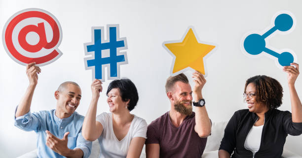 istock People holding an social media icon 1056156606