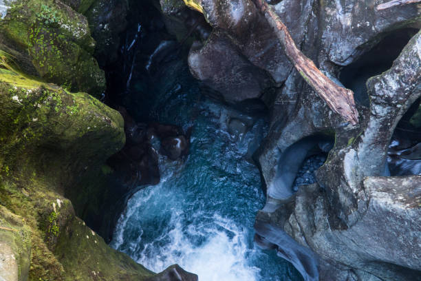 istock river water flowing through rocks and canyon with moss on rocks 1056157816