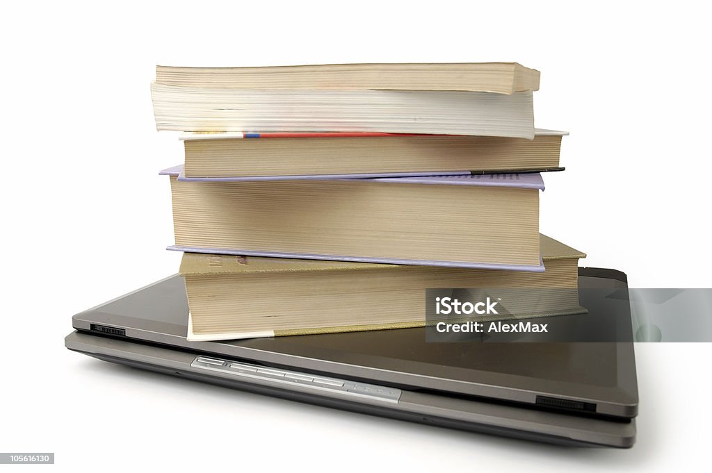 Pile of books on laptop computer information and media concept  Abstract Stock Photo