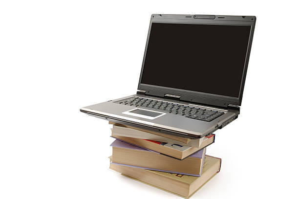istock Laptop computer on pile of books isolated 105616173