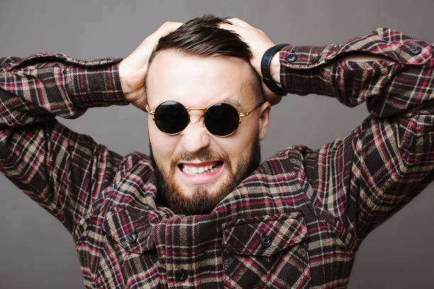 istock Stressed male in sunglasses 1056162394