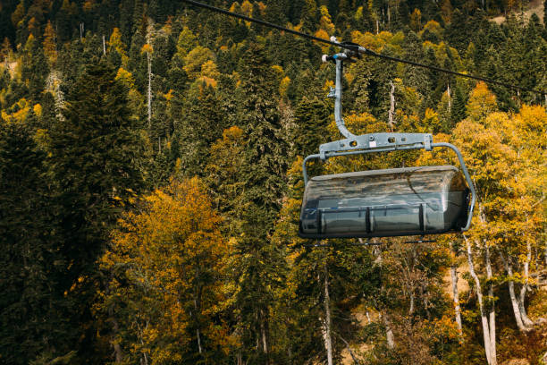 istock Funicular high in the mountains above the autumn forest 1056174040