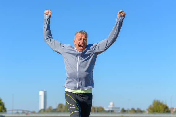 istock Happy fit man cheering and celebrating 1056174638