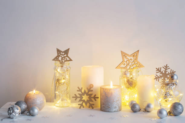 istock Christmas decoration with candles on background  white wall 1056181690