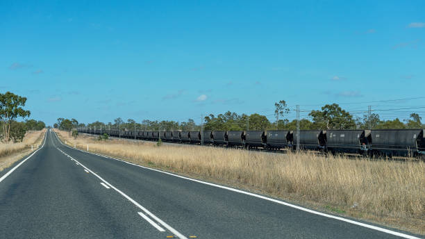 train hauling coal from open cut mine - train coal mining australia imagens e fotografias de stock