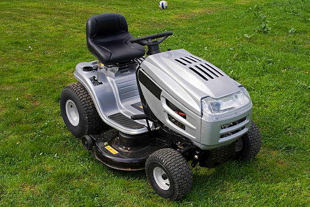 istock Silver riding lawn mower sitting on lawn 105618592