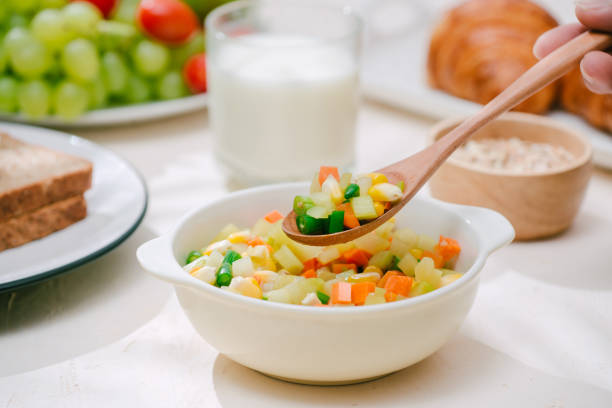 istock Light healthy Breakfast with oatmeal. Hercules, nuts, fruit, boiled eggs, bread. Tableware. Healthy food. 1056186728