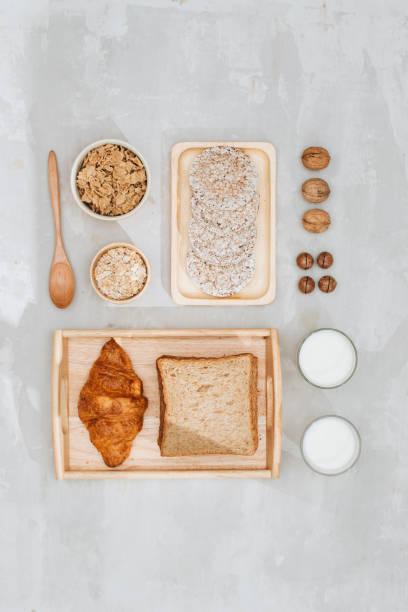 istock continental breakfast - toast, croissants, mix nuts, milk 1056191244