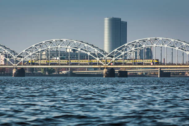 istock Railway bridge in Riga over the Daugava River in the fall in October on a sunny day 1056195580