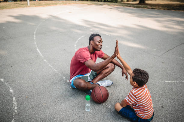 istock Father and son playing basketball 1056197310