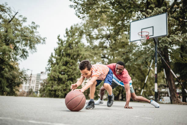 istock Father and son playing basketball 1056197836