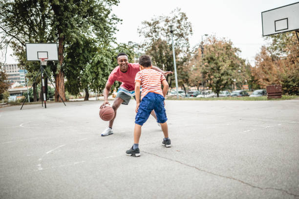 istock Father and son playing basketball 1056197880