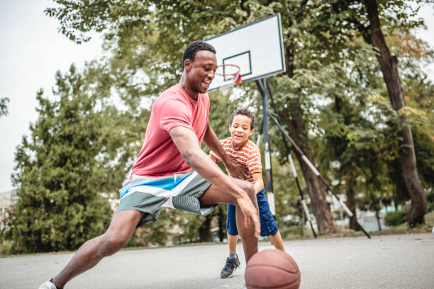 istock Father and son playing basketball 1056197882