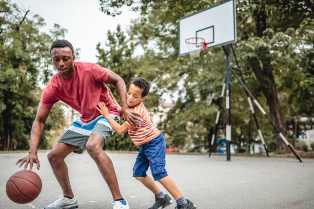 istock Father and son playing basketball 1056197886