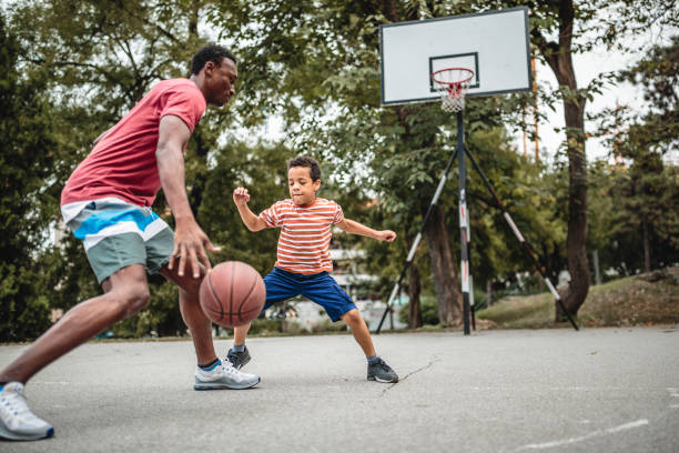 istock Father and son playing basketball 1056197898