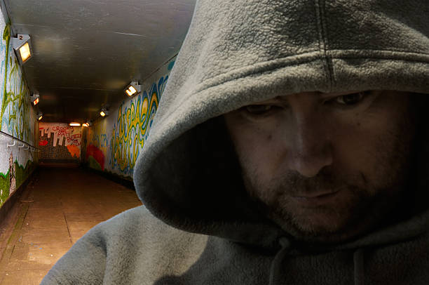 istock Hooded man in graffiti-decorated subway 105619801