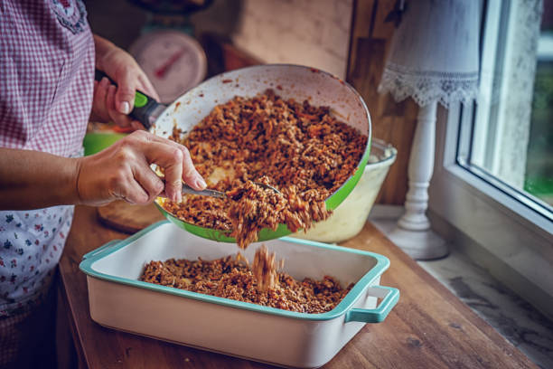Preparing Traditional Shepard`s Pie in Domestic Kitchen