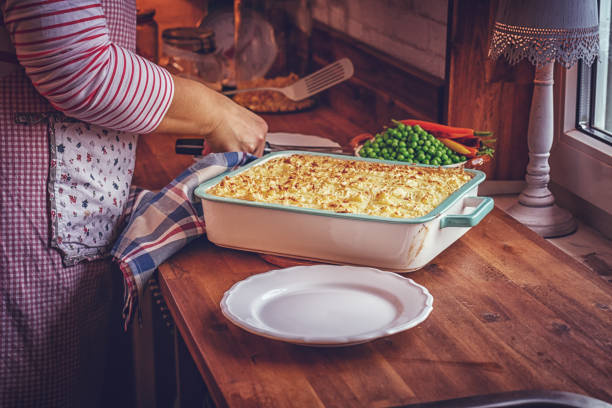 Preparing Traditional Shepard`s Pie in Domestic Kitchen