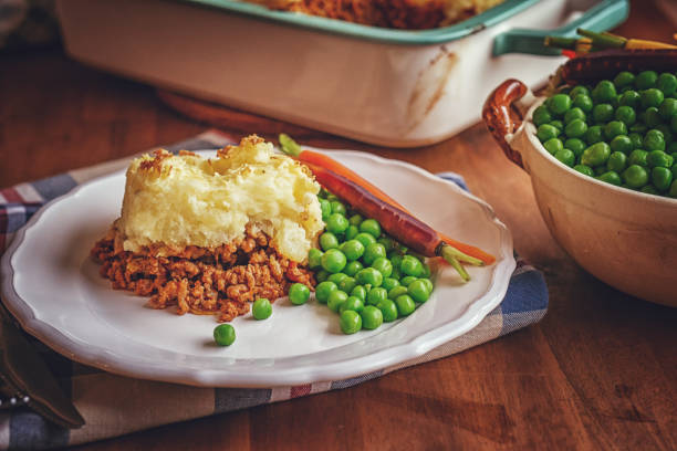 istock Preparing Traditional Shepard`s Pie in Domestic Kitchen 1056203182
