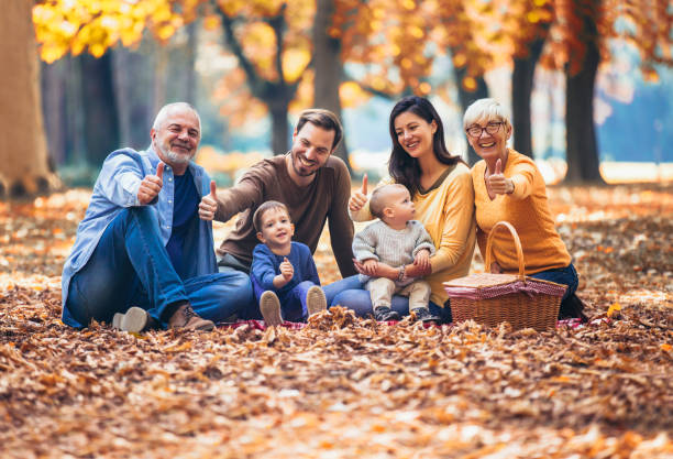 istock Multl generation family in autumn park having fun 1056207234