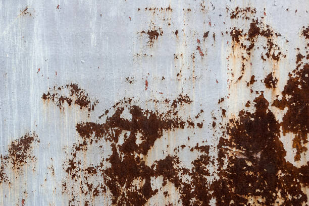 istock Grunge metal painted texture. Old painted metal surface with rust and wet spot 1056207258