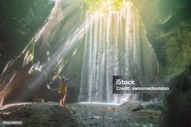 Traveling Young Woman Arms Outstretched In Tropical Rainforest In Bali Embracing The Beauty In Nature People Travel Nature Concept Stock Photo - Download Image Now