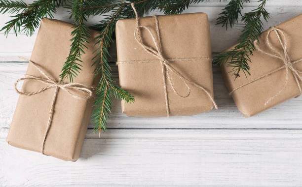 istock composition of Christmas gift boxes and Christmas tree branches 1056208092