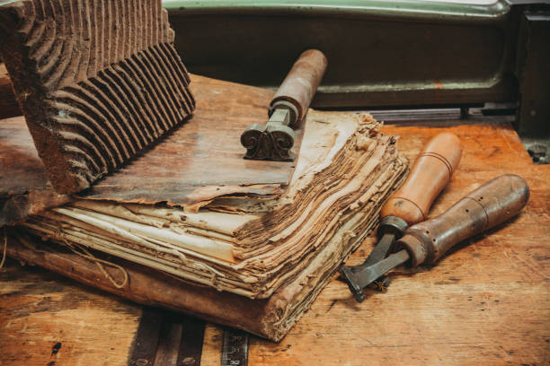 istock Restoration laboratory Ancient books surrounded by tools and equipment. 1056208206