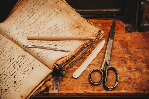 istock Restoration laboratory Ancient books surrounded by tools and equipment. 1056208230