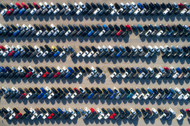 Aerial View of Rows of Cars Aerial view of new cars of different brands parked in rows on a lot. car for sale stock pictures, royalty-free photos & images