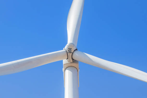 istock close up white wind turbine with blue sky 1056213378