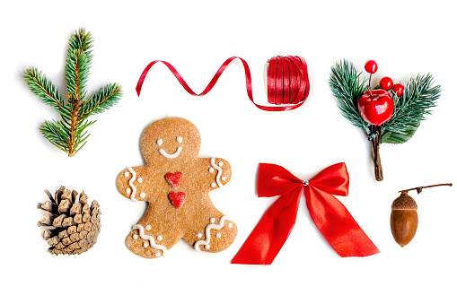 Isolated Christmas decorations, flat lay. Christmas composition with fir tree branches, gingerbread  Cookie  and holiday ornament on white background