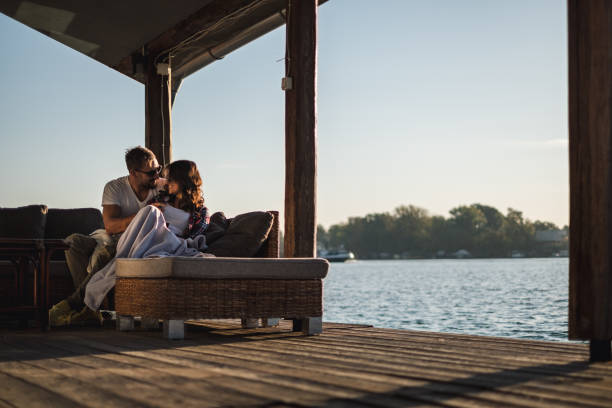 istock Smiling couple looking at each other by the river 1056227004