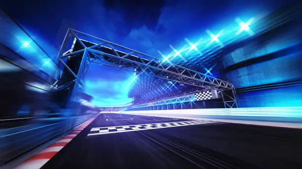 Photo of finish gate on racetrack stadium and spotlights in motion blur